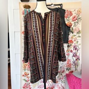 Women’s size PL/G jersey tunic. 3/4 sleeves good condition. Black, red, gold